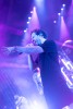 Band members perform on stage