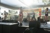 Musicians perform on stage at Riverside Pride